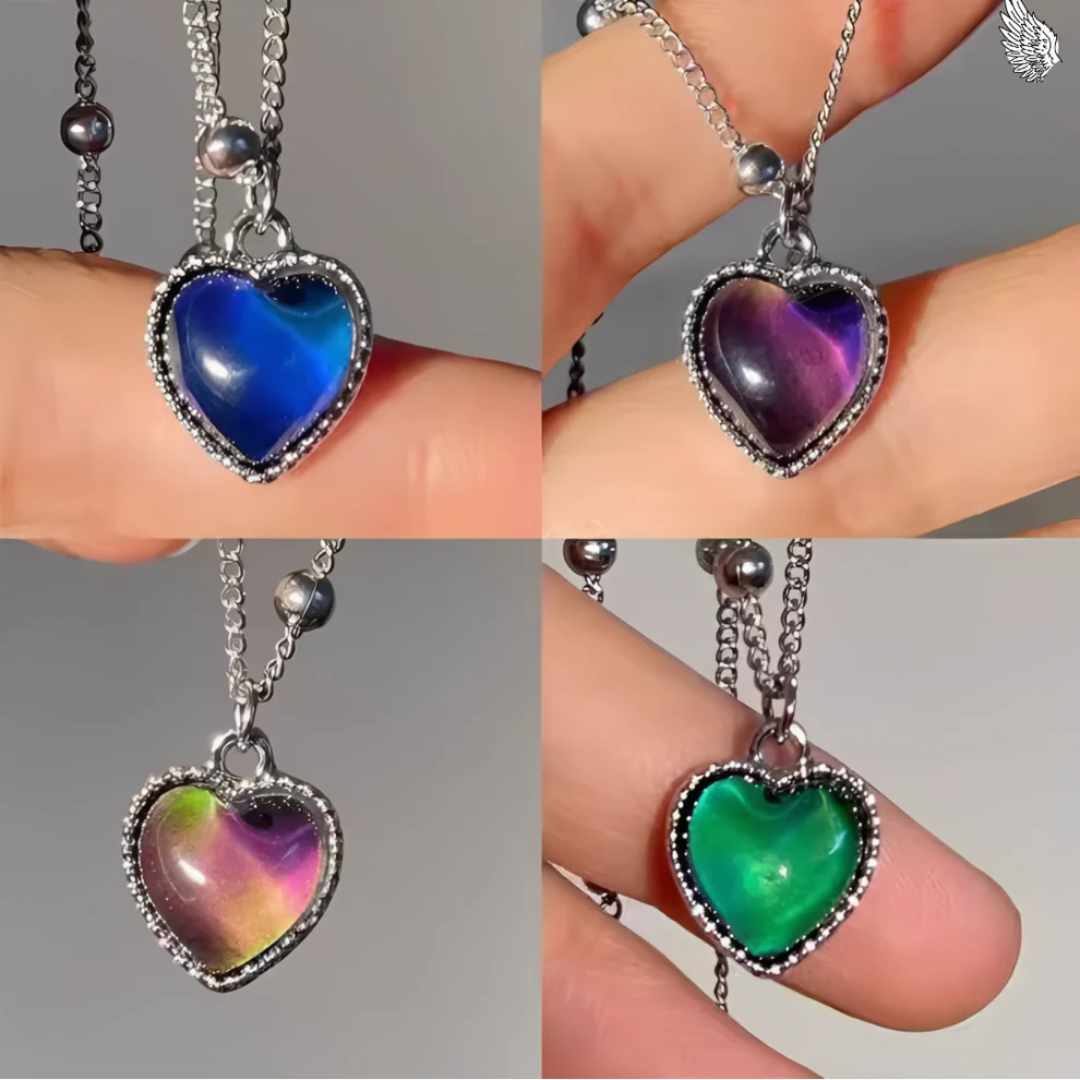 Four close-ups of the Aura Heart pendant held between fingertips, showing the stone in blue, purple, pink and green