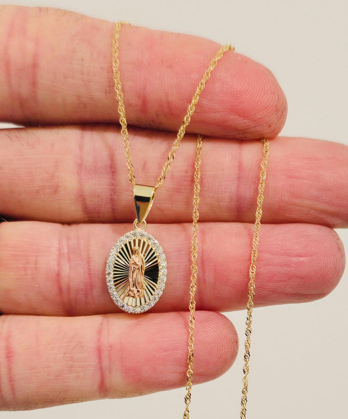 The Guadalupe Pendant Necklace pendant detail with clear stones