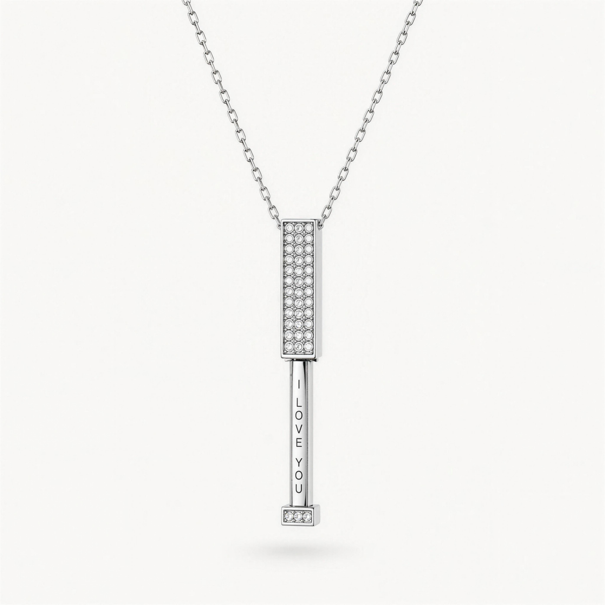 The I Love You Necklace in silver, opened to reveal the hidden I love you message