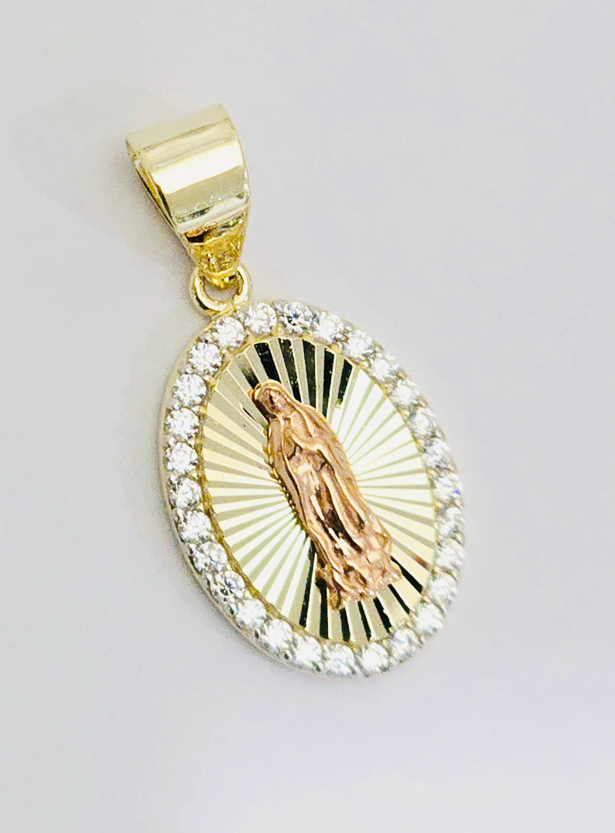 The Guadalupe Pendant Necklace worn with a fine chain